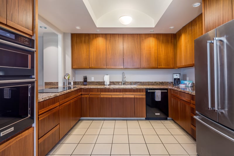 Expansive kitchen layout with ample counter space for preparing island feasts.