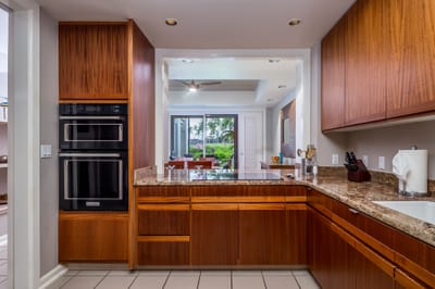 Fully equipped gourmet kitchen with stainless steel appliances and custom cabinetry.