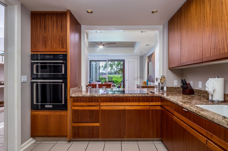 Fully equipped gourmet kitchen with stainless steel appliances and custom cabinetry.