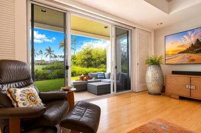 Open-concept living area with plush seating, seamlessly flowing to the outdoor lanai.