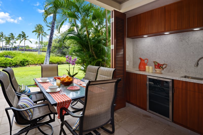 Dine al fresco on the spacious lanai featuring a built-in outdoor BBQ kitchen.