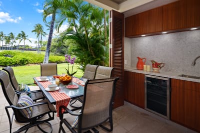Dine al fresco on the spacious lanai featuring a built-in outdoor BBQ kitchen.
