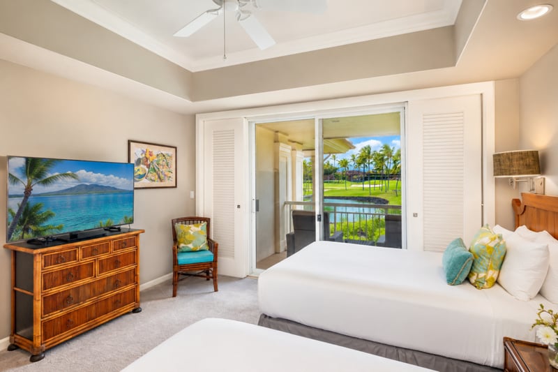 The 2nd bedroom features two double beds, perfect for additional guests