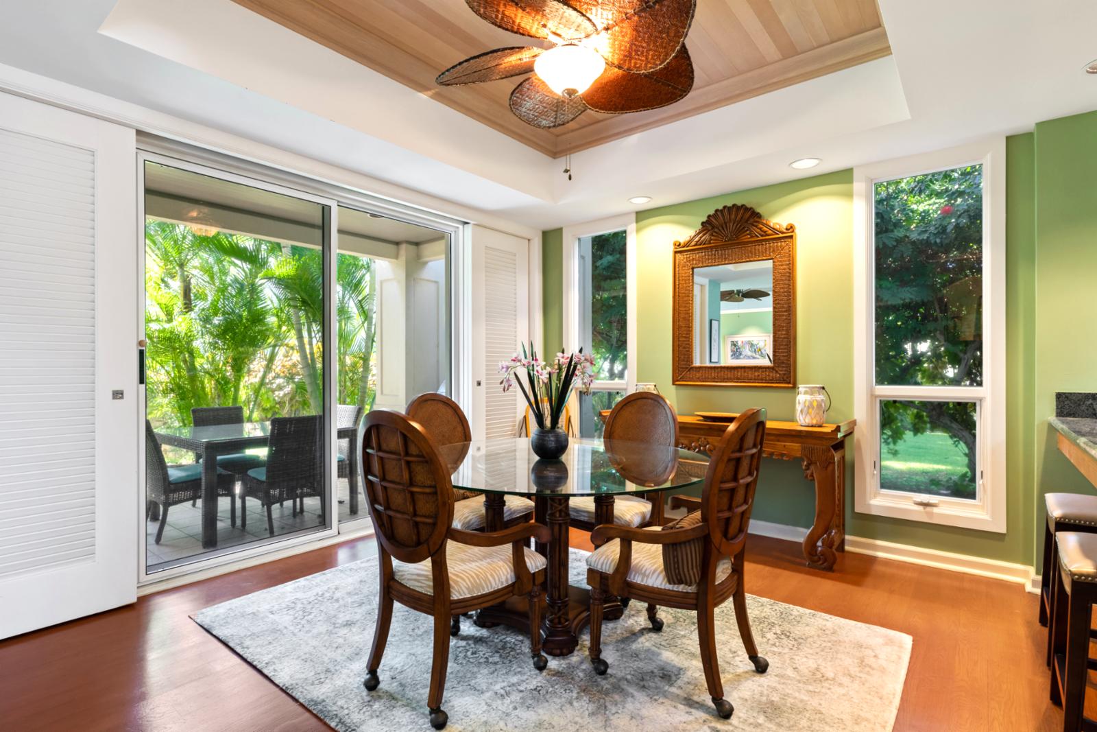 Tropical dining oasis with natural light, greenery, and island charm.