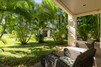 Elegant outdoor living—perfect for morning reads or evening wine under the trees