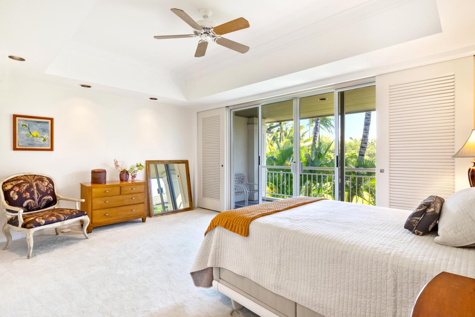 Experience comfort and tranquility in this island-inspired room with balcony garden views
