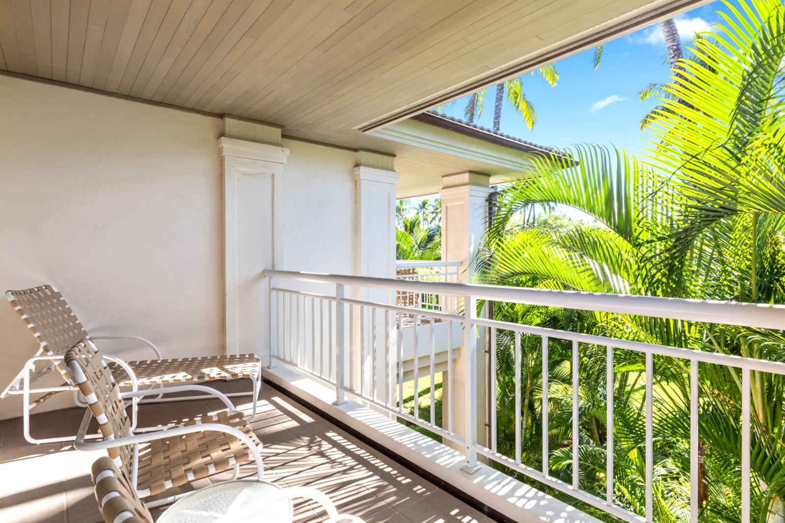 Enjoy alfresco moments in this breezy nook nestled among lush palms