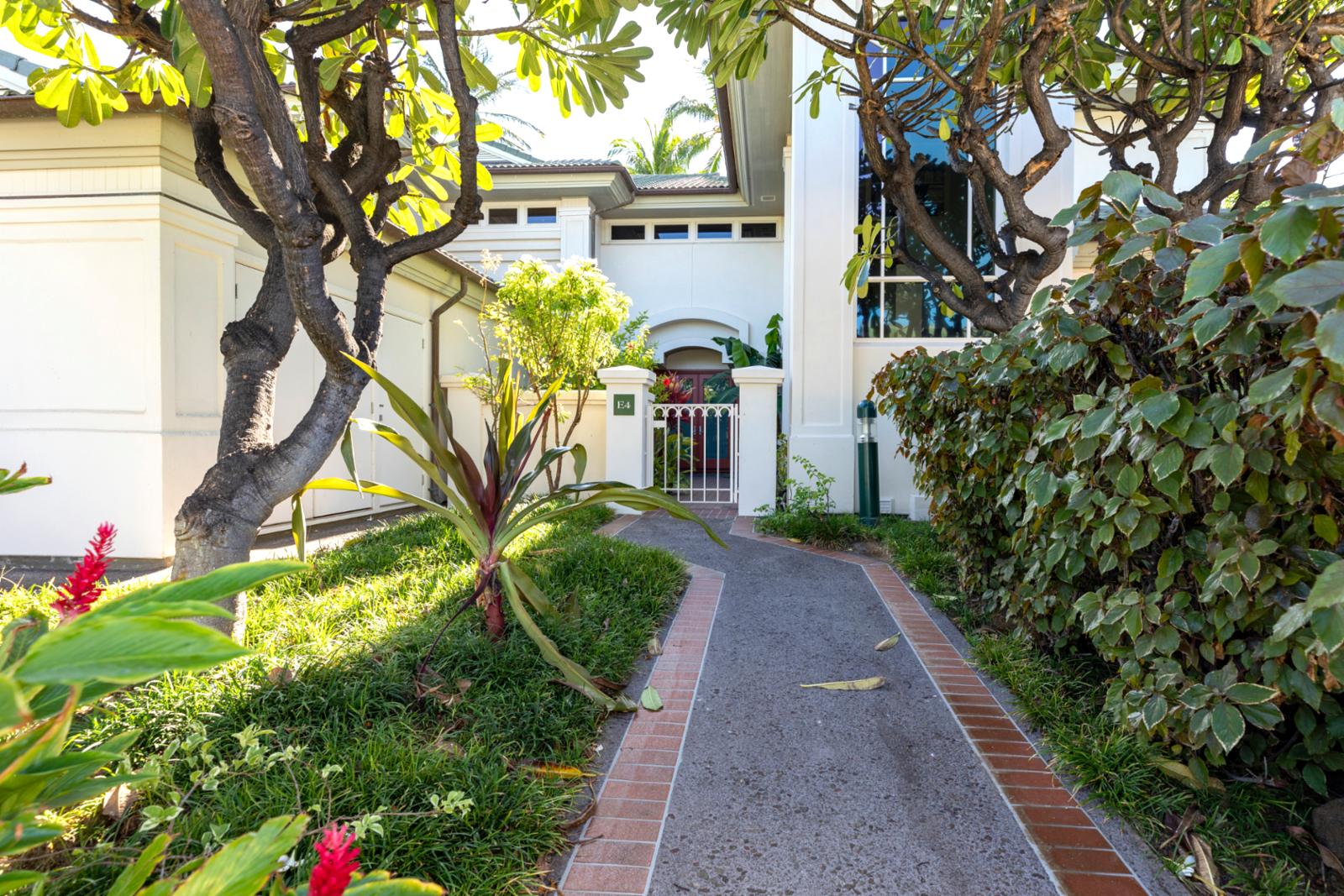 A charming front entry with peaceful vibes and island touches
