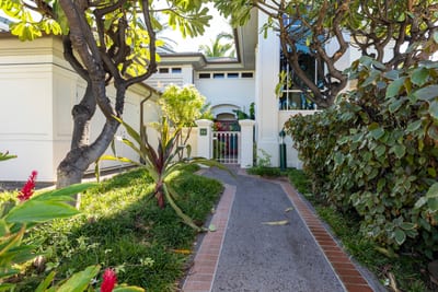 A charming front entry with peaceful vibes and island touches