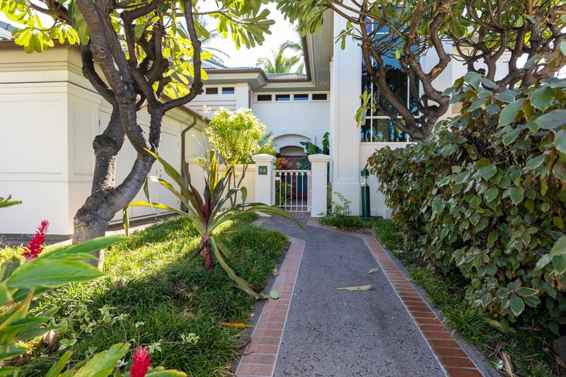 A charming front entry with peaceful vibes and island touches