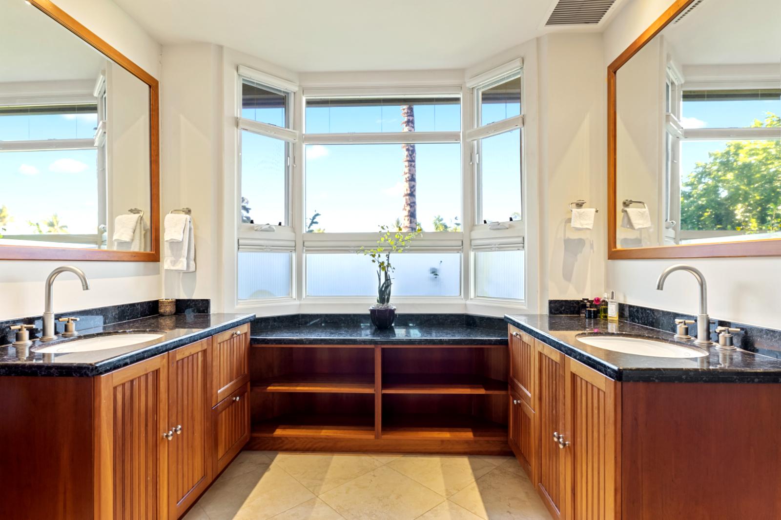 Sunlit spa-style bathroom with rich wood, sleek stone, and serene views