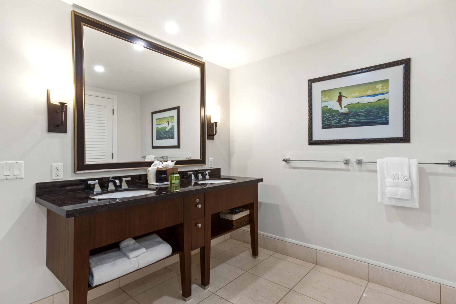 The master bath features granite finishes and walk-in shower