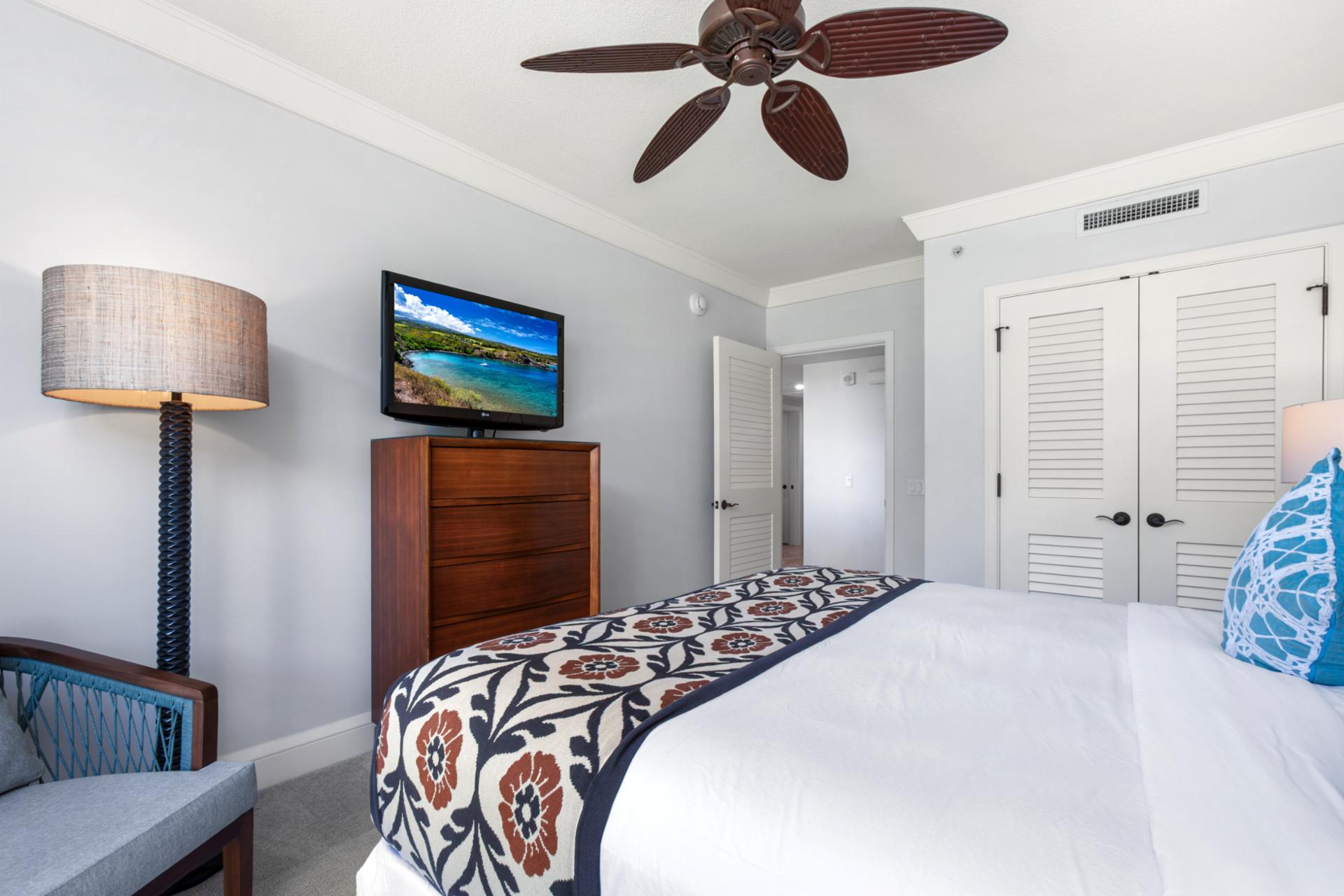 Comfortable guest bedroom with ceiling fan and tasteful decor