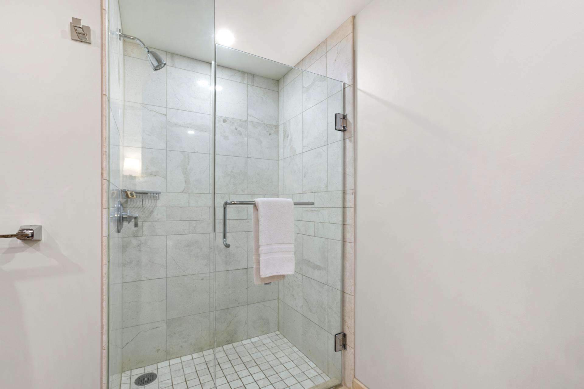 Bright and modern guest bathroom with glass shower