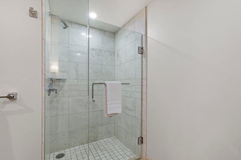 Bright and modern guest bathroom with glass shower