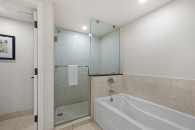 Modern bathroom with glass shower, deep soaking tub, and elegance. HKH-204