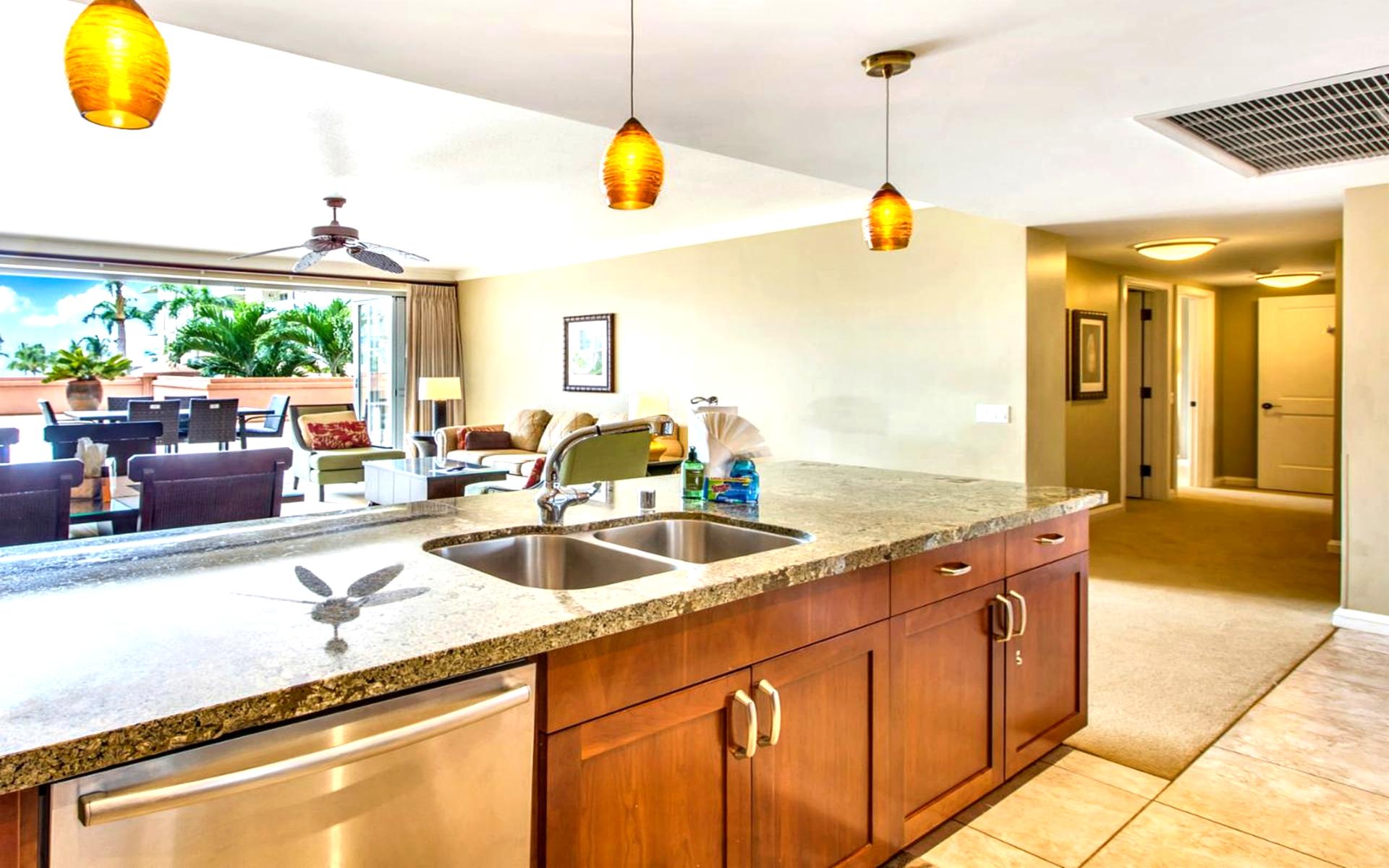 Natural light, granite countertops, and golden wood tones—kitchen dreams delivered