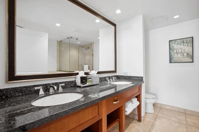 Spacious bathroom with double sinks, tropical touches, and good vibes HKH-236