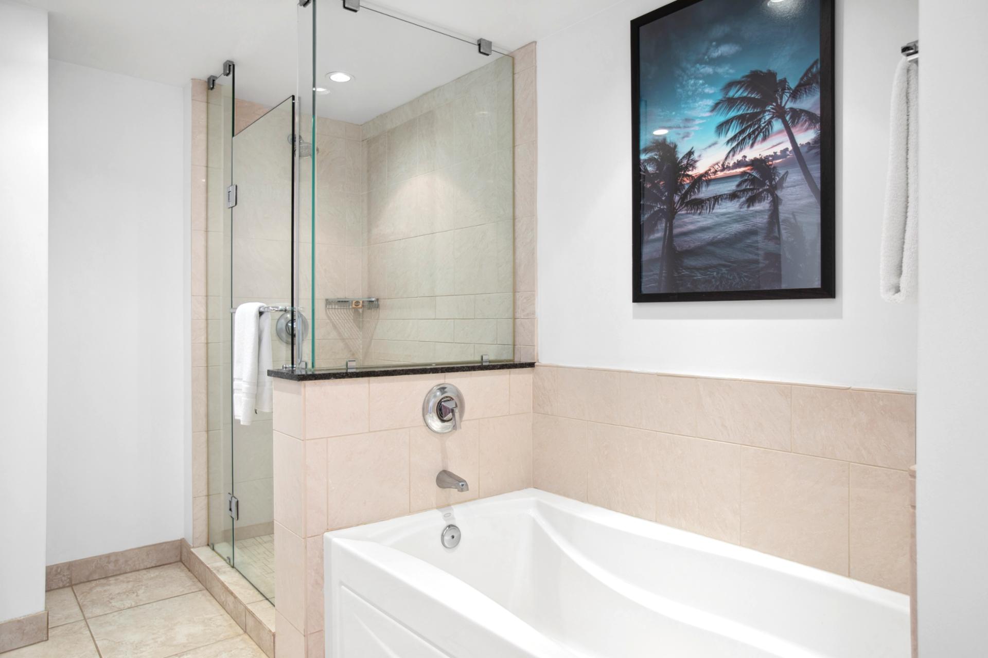 Unwind in style: spa tub, glass shower, and ultimate tranquility