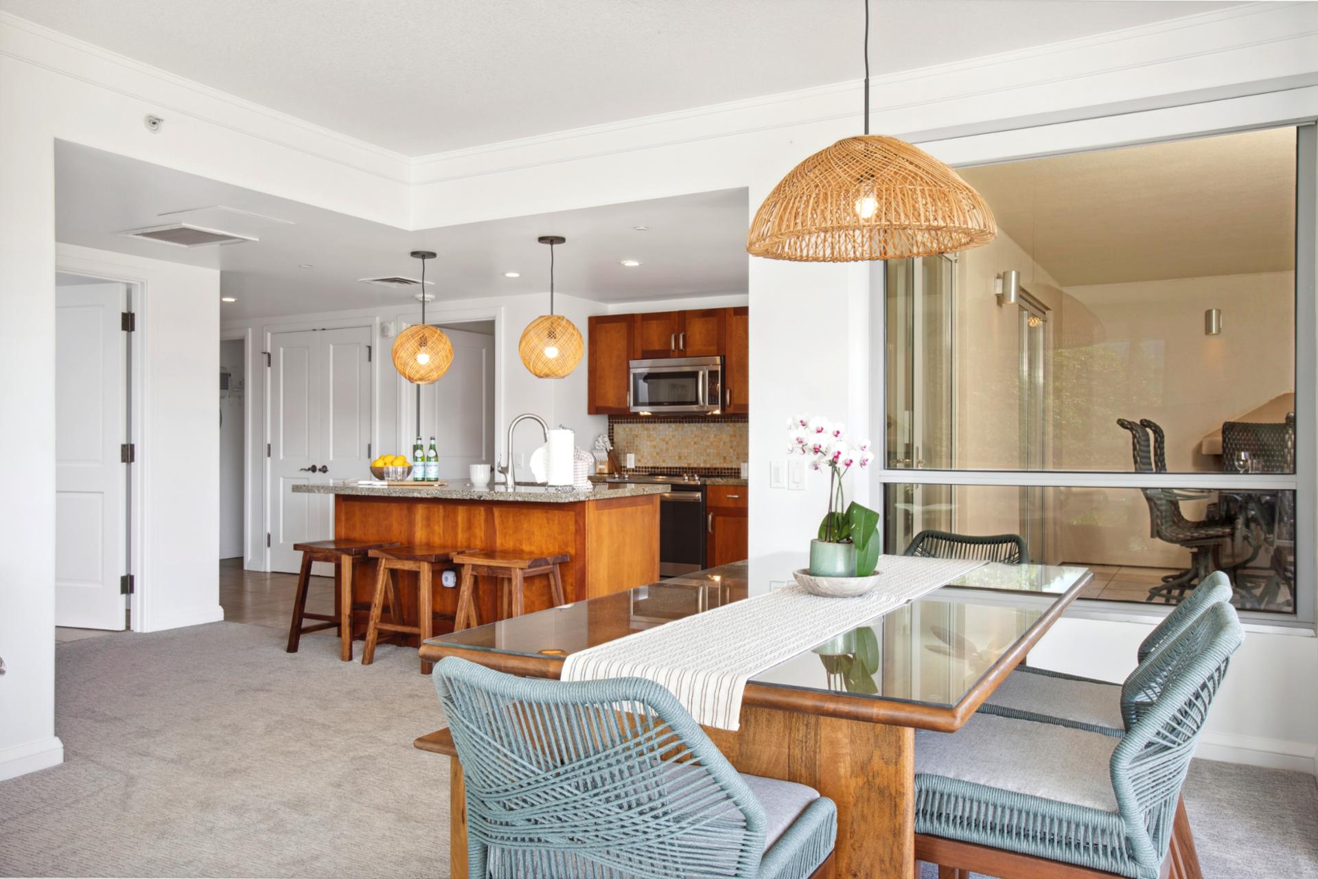 Gather here with family and friends with your cozy tropical kitchen just steps away