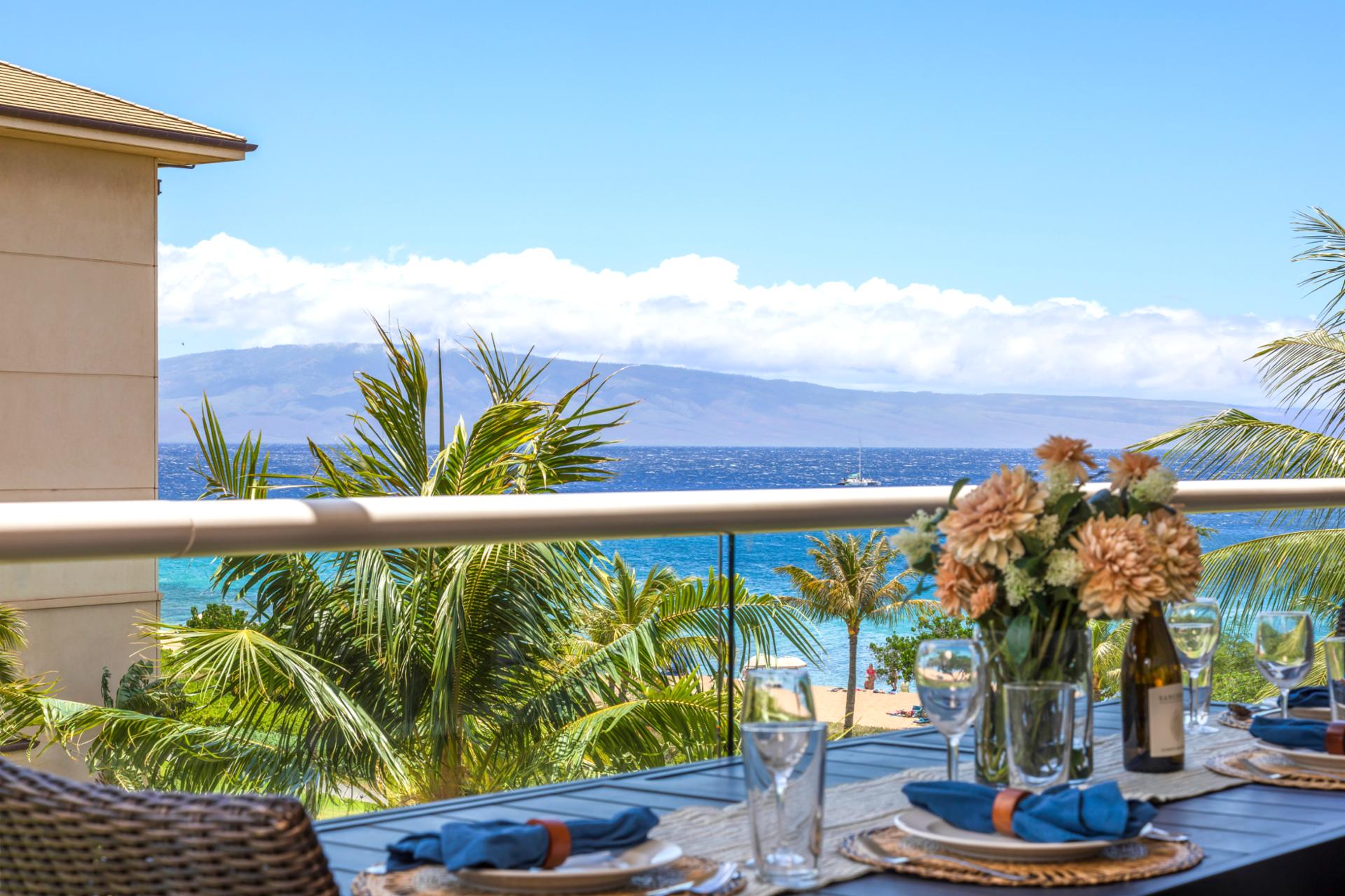 Palm trees sway, ocean waves play, and your table’s set for paradise on this stunning lanai