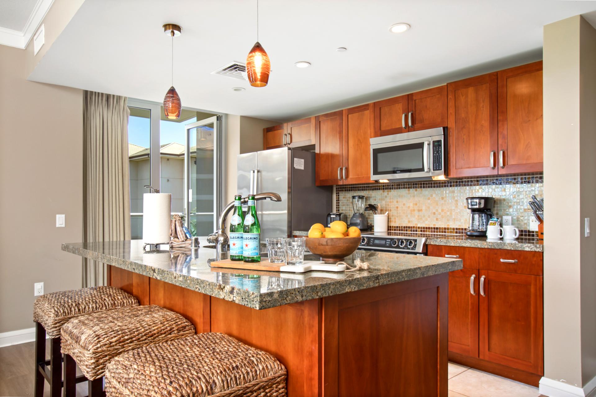 This bright, open kitchen invites you to slow down, sip something good, and savor every moment around the island