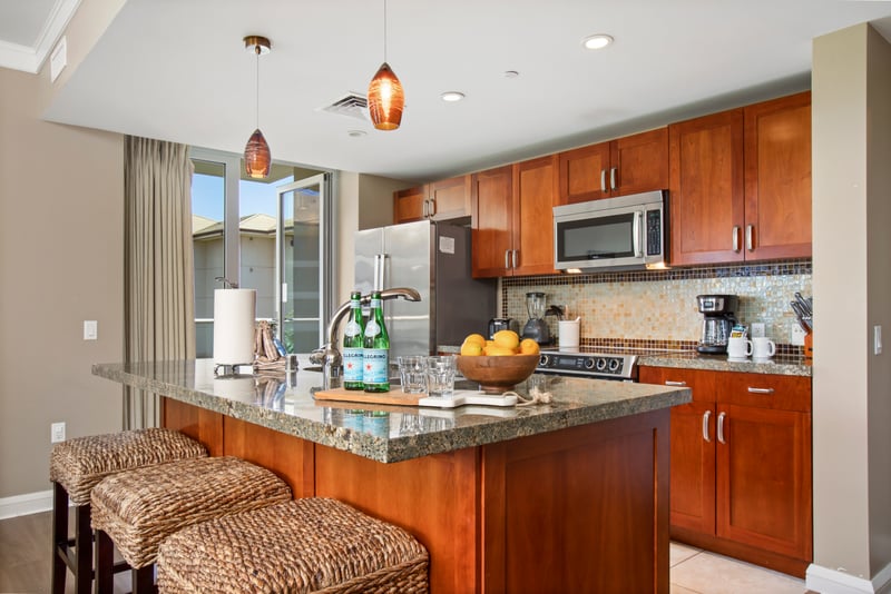 This bright, open kitchen invites you to slow down, sip something good, and savor every moment around the island