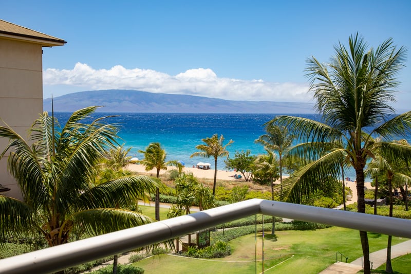 Golden sand, turquoise waves, swaying palms—perfect day in paradise