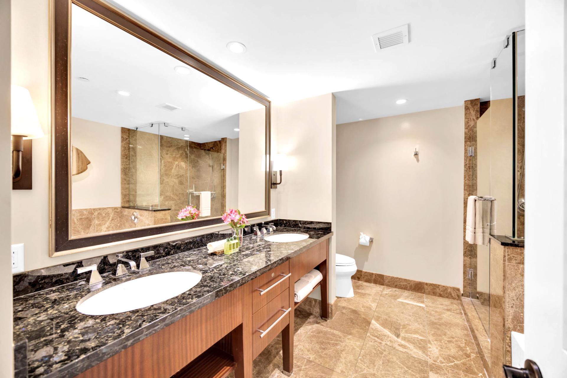 Sleek vanity and rich textures bring hotel-style luxury to every stay