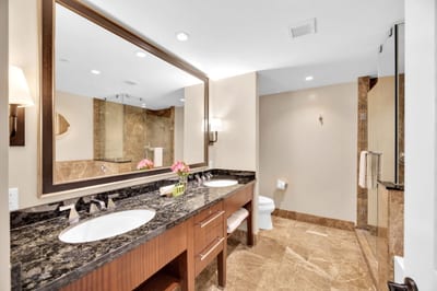 Sleek vanity and rich textures bring hotel-style luxury to every stay