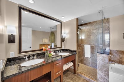 Dual vanities, marble finishes—your private in-room sanctuary
