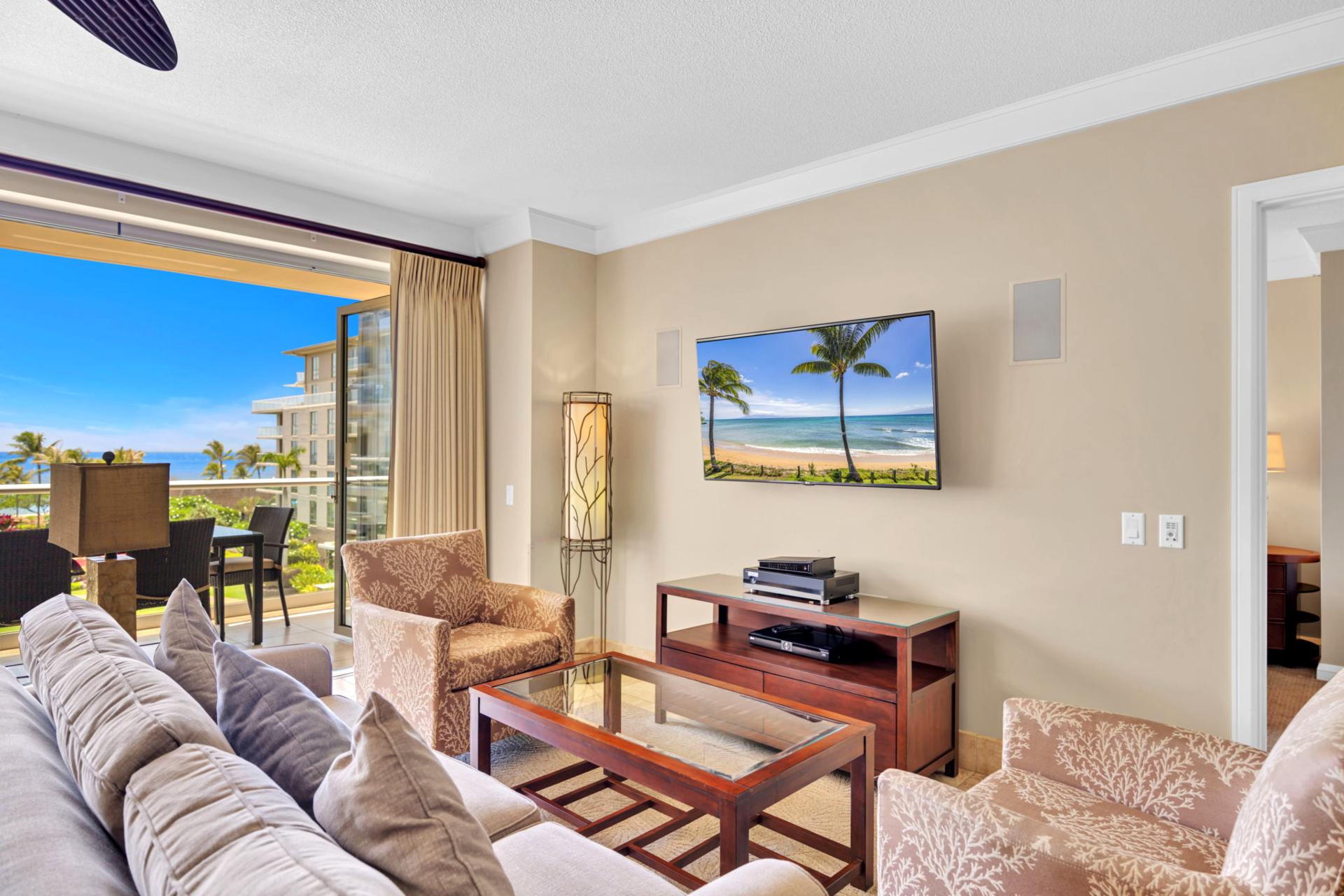 Unwind in breezy island comfort with ocean views right from the sofa