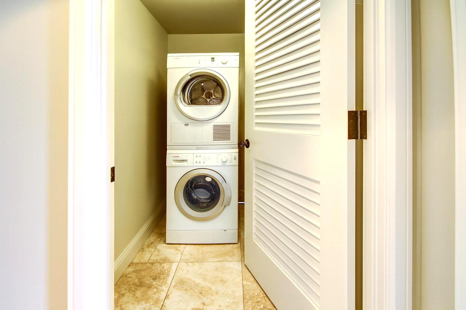 Full-size laundry tucked away so fresh clothes and beach towels are always within reach