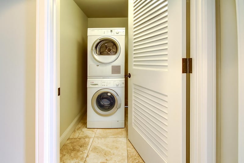 Full-size laundry tucked away so fresh clothes and beach towels are always within reach