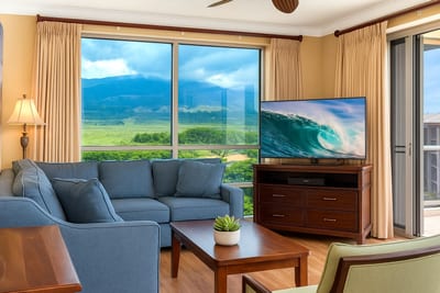 Spacious, sun-filled living room with panoramic floor-to-ceiling views of Maui's lush landscapes HKH-520