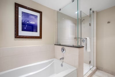Elegant bathroom features soaking tub and glass shower for ultimate relaxation or quick rinses after tropical adventures HKH-520