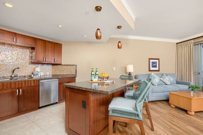 Whip up island-inspired meals in a stylish kitchen with granite counters and a view of the living space