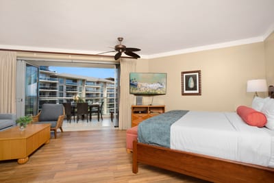 Enjoy ocean breezes and balcony access right from your king-size bed in this bright and airy master studio