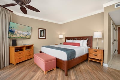 Unwind in a serene setting featuring warm tones and luxury linens