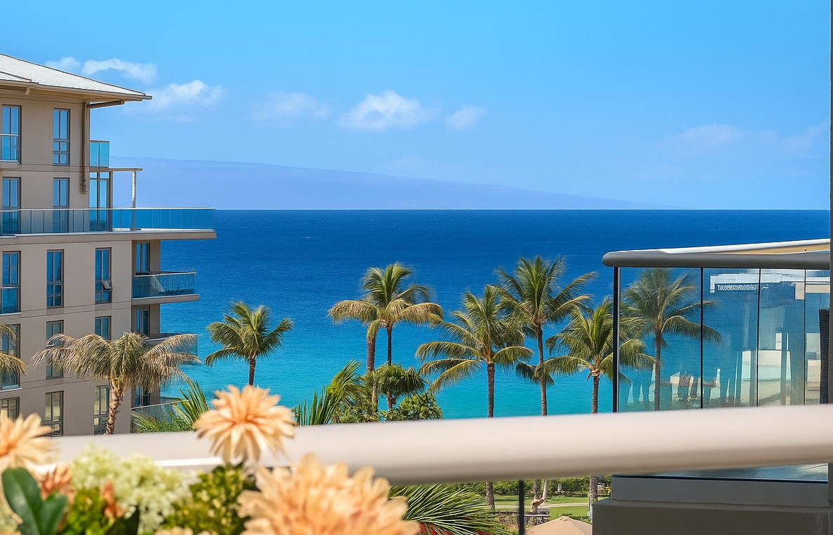 Wake up to postcard-perfect views of turquoise waters, swaying palms, and blue skies from your oceanfront lanai HKH-537