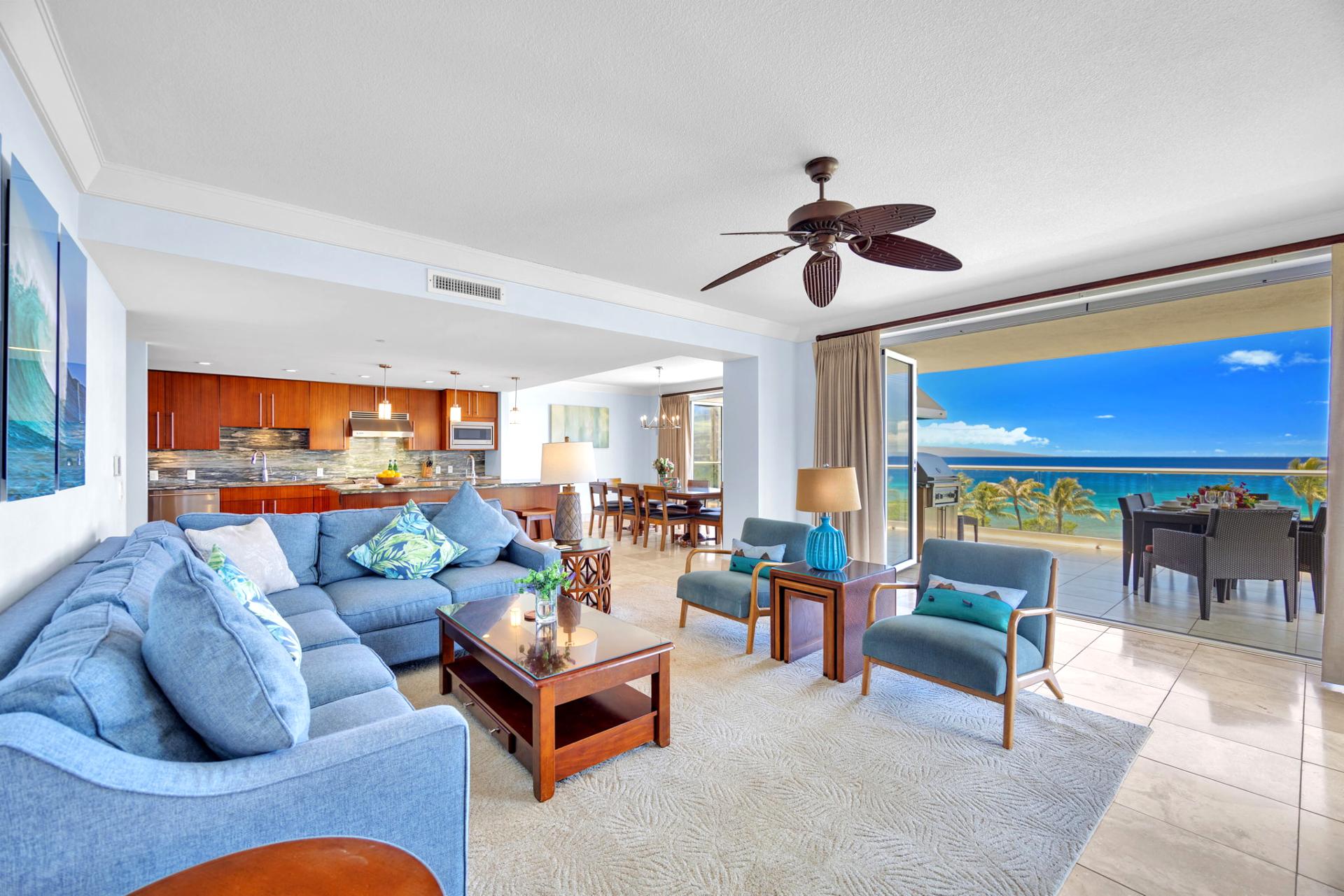 Comfortable coastal-style living room with flat-screen TV and direct lanai access.