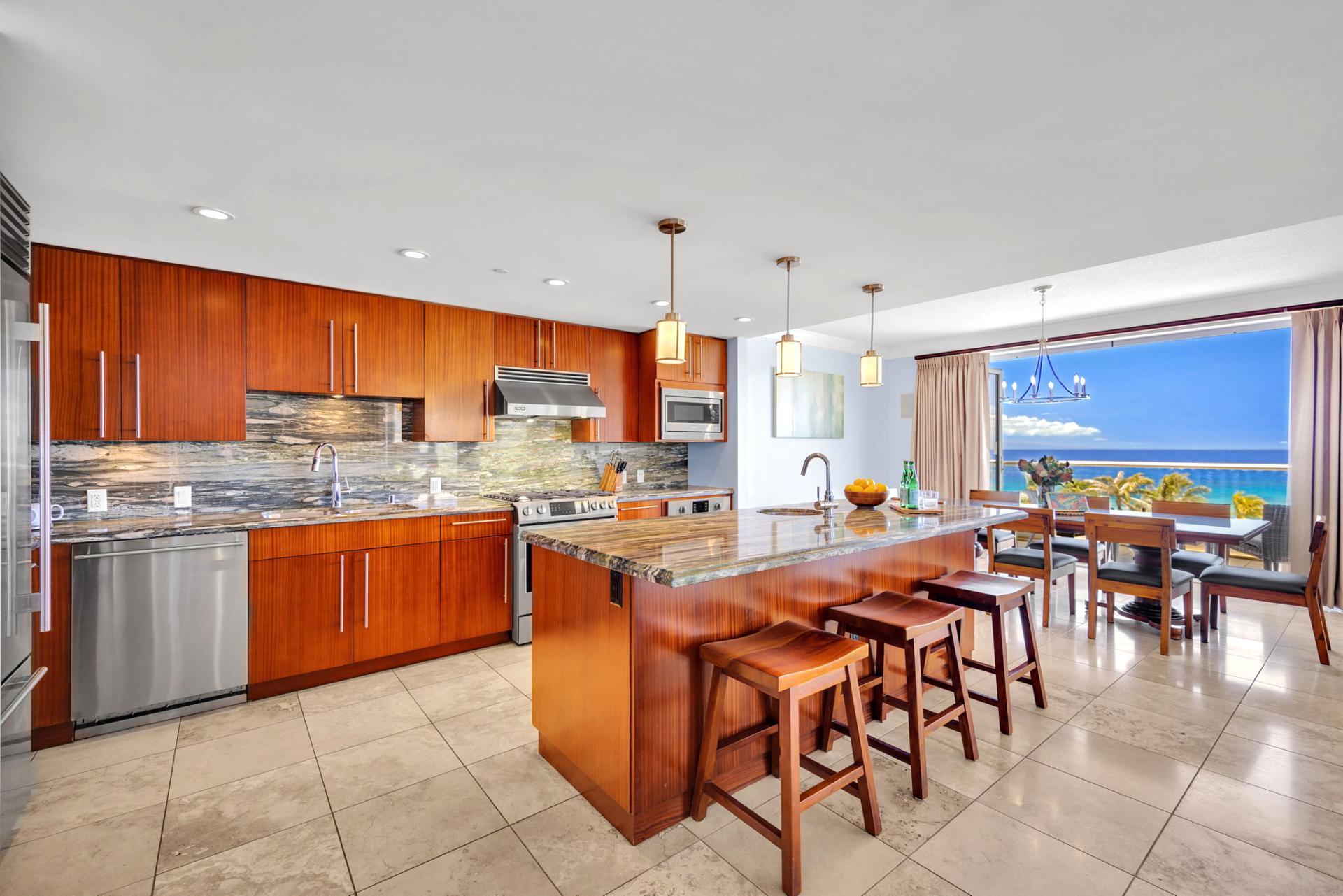 Fully equipped gourmet kitchen with granite countertops and premium appliances.