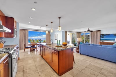 Expansive kitchen layout with large island bar and ocean glimpses. HKH-550