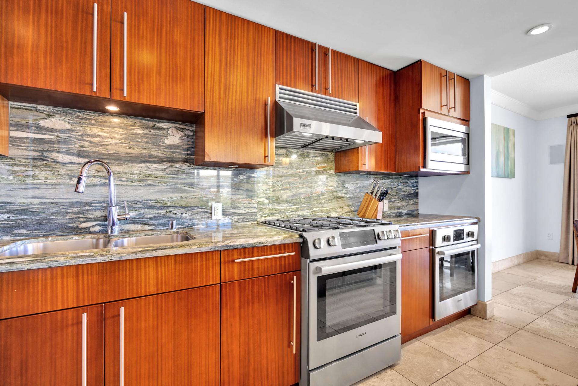 Warm wooden cabinetry and stainless steel appliances