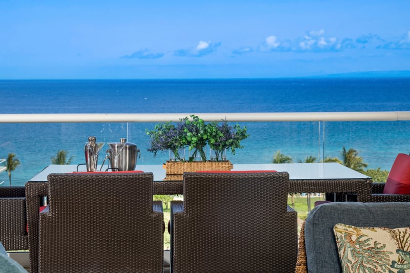Sip, relax, and soak in breathtaking ocean views from this elegant lanai 