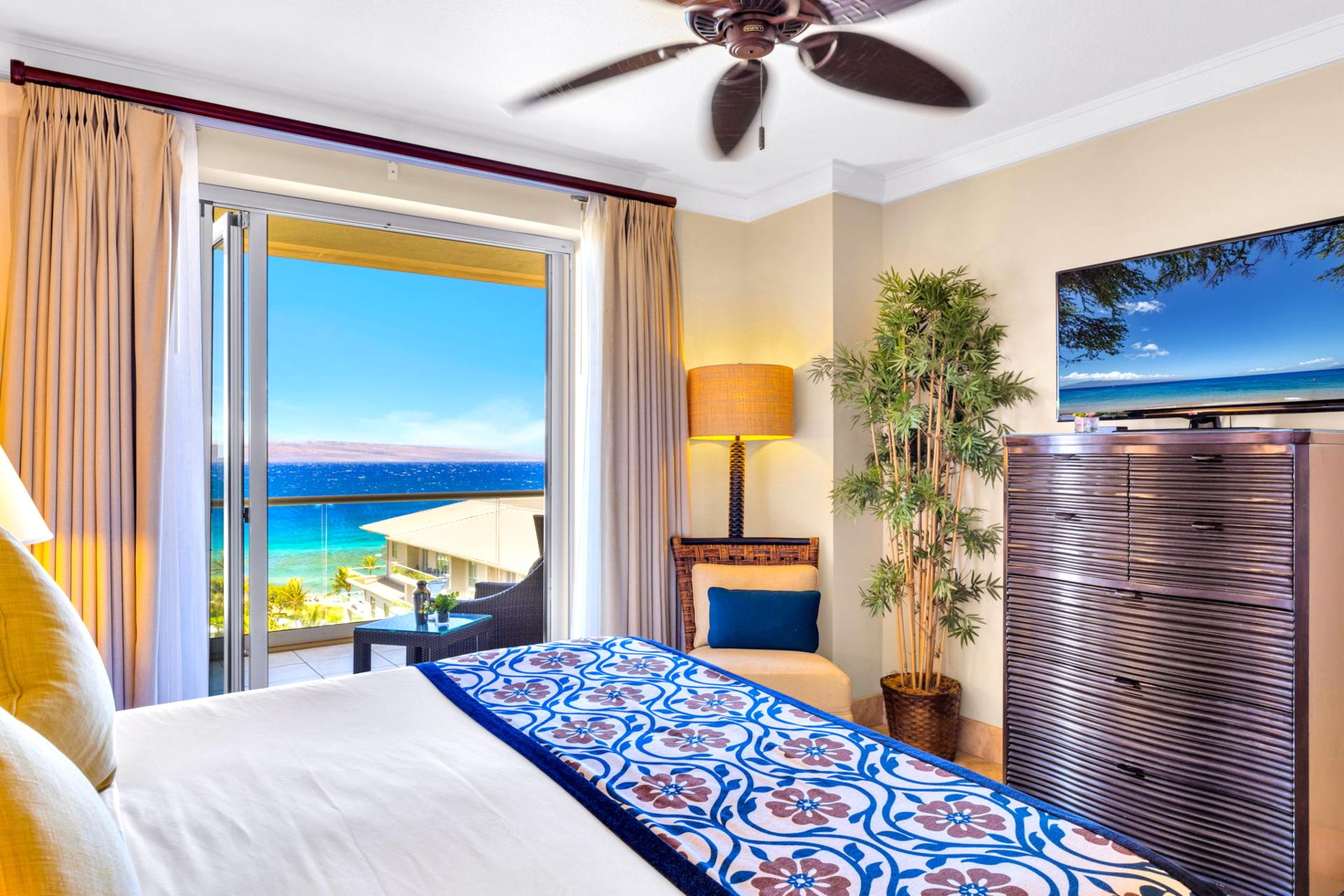 The guest bedroom also features lanai access and ocean views