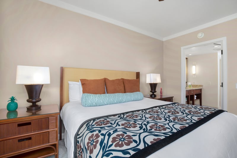 Tranquil bedroom retreat with ensuite access and charming tropical touches.