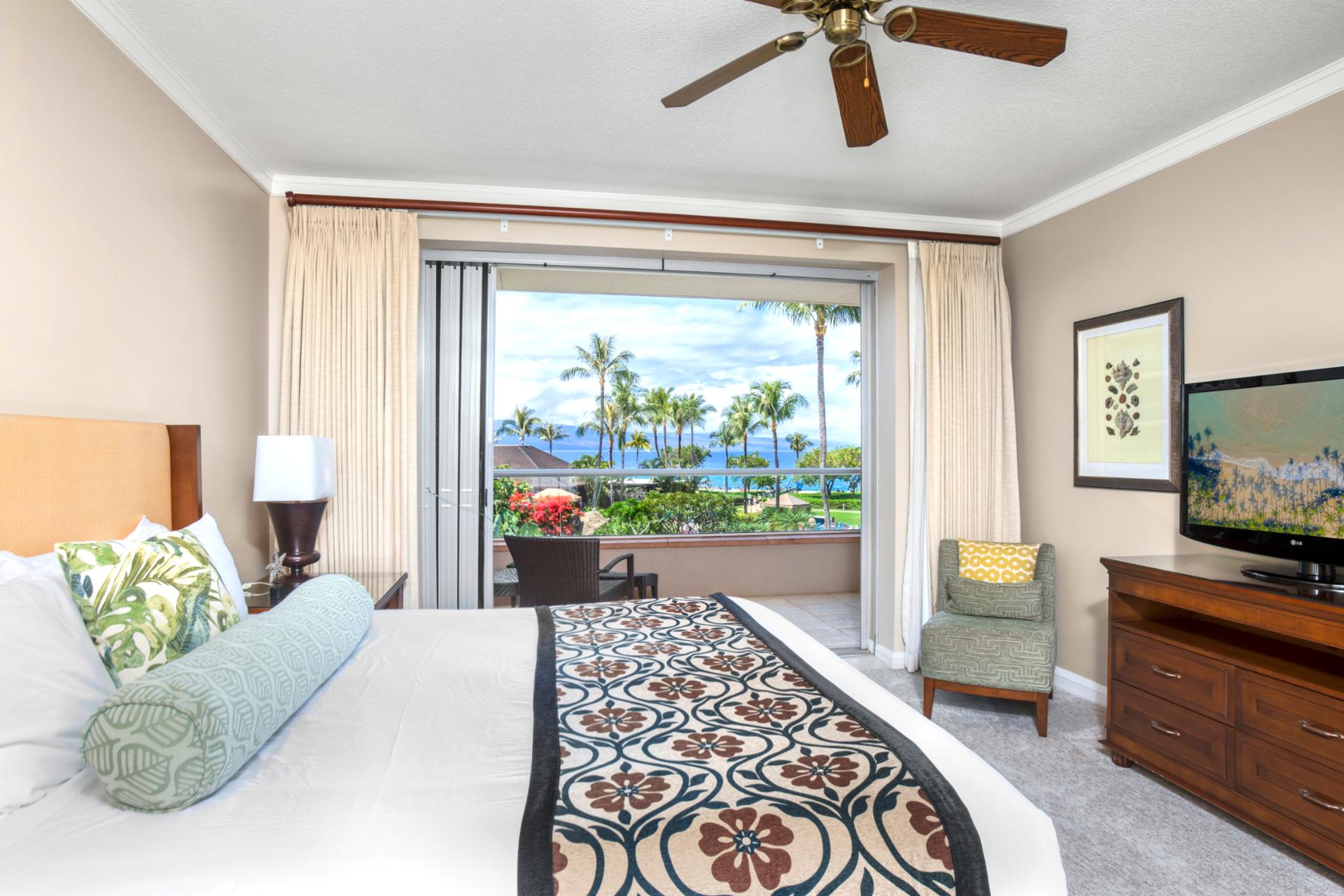 Relaxing bedroom sanctuary with lanai and breathtaking oceanfront palm views.