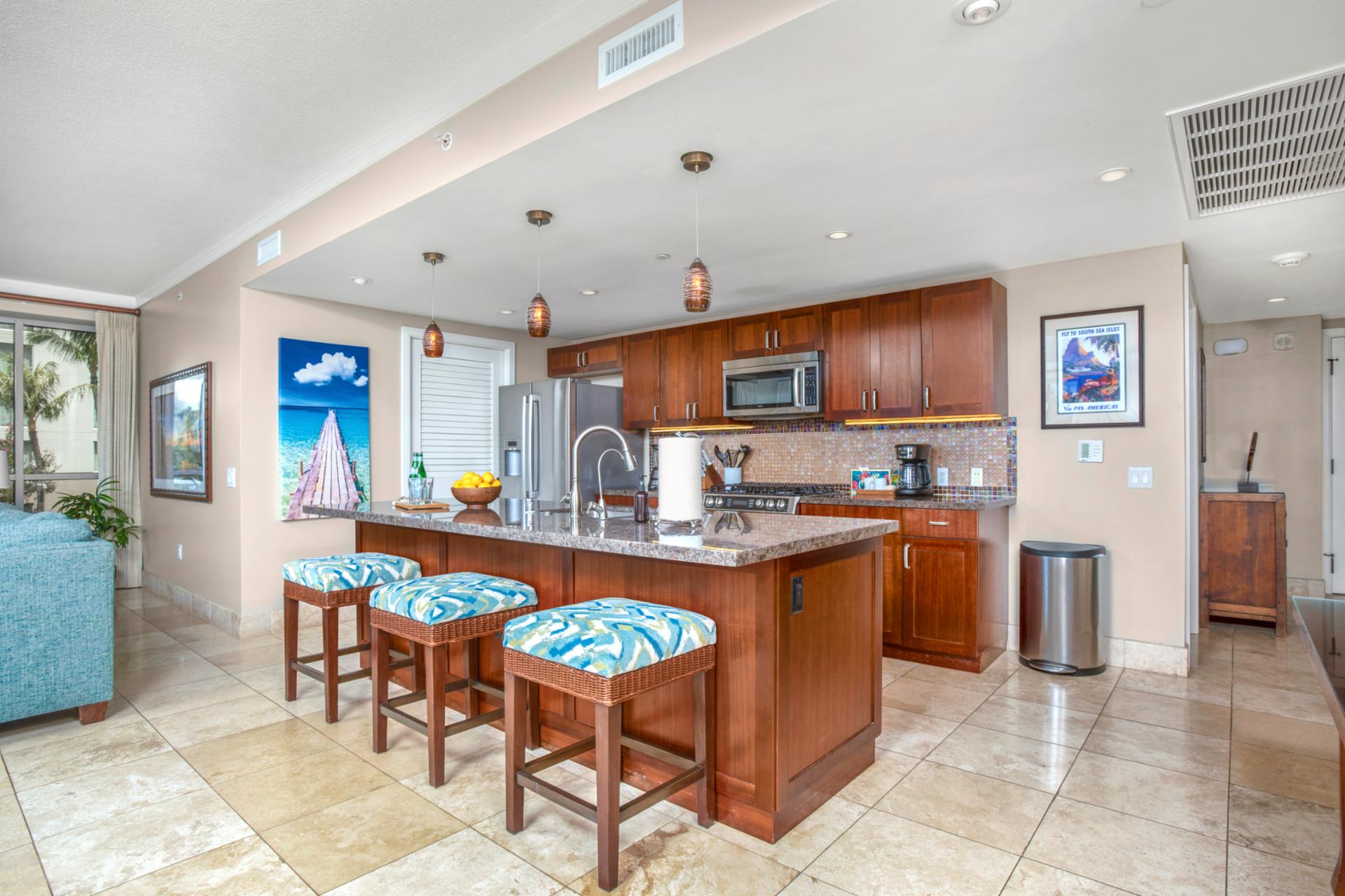 Modern island kitchen with vibrant accents and luxury resort-style comfort.