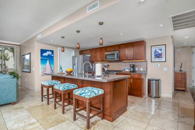 Modern island kitchen with vibrant accents and luxury resort-style comfort. HKK-201